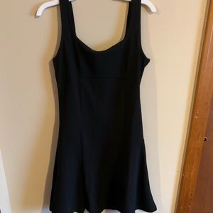 A black dress with tank top like sleeves.